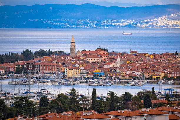 Town of Izola waterfront and bay aerial view, Slovenia coastline Town of Izola waterfront and bay aerial view, Slovenia coastline koper slovenia stock pictures, royalty-free photos & images