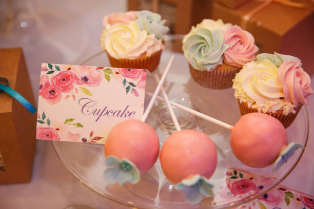 istock Cupcake and other sweets on candy bar. Catering service at wedding day 908755808