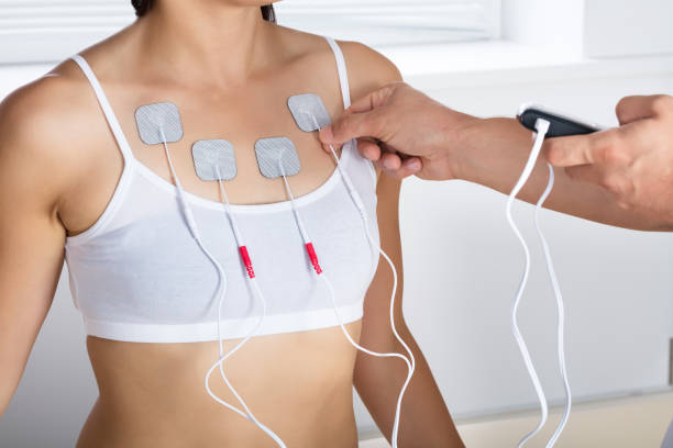 istock Therapist Giving Electrodes Therapy To Woman 908765082