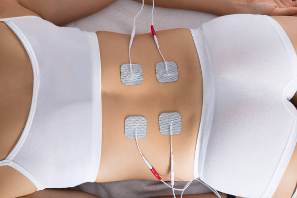 istock Woman Lying With Electrodes On Her Back 908765106