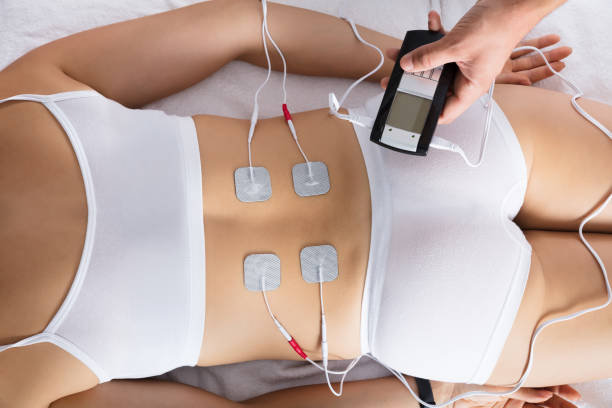 istock Woman Lying With Electrodes On Her Back 908765132