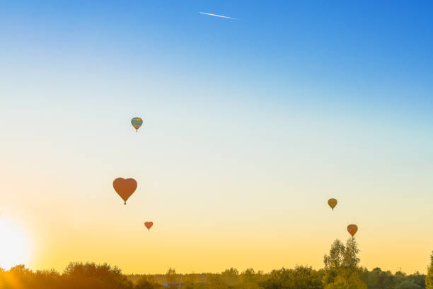 istock Stage sunset, balloons at sunset in summer 908778654
