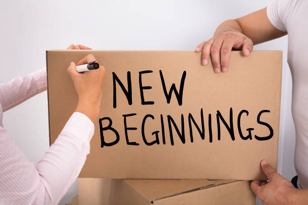 istock Woman Writing New Beginnings On Box 908785760