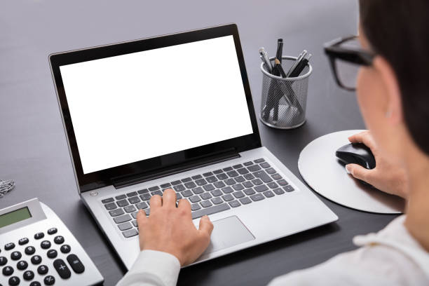 istock Businesswoman Using Laptop On Desk 908793302