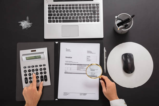 istock Businesswoman Calculating Invoice 908793350