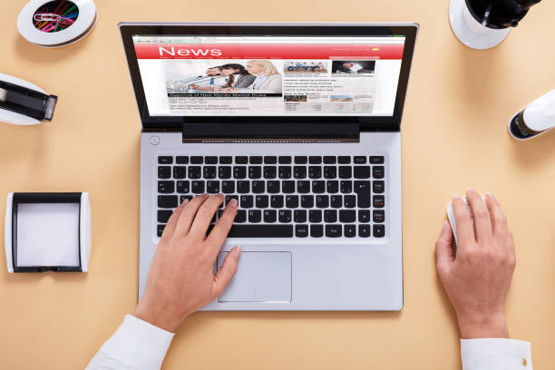 istock Businessperson Reading News On Digital Tablet 908793362