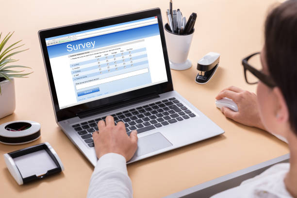 istock Businesswoman Filling Survey Form 908793368