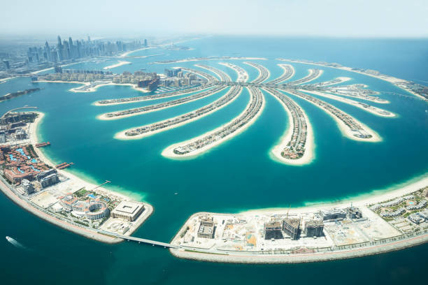 Aerial View Of Palm Island In Dubai An Artificial Jumeirah Palm Island On Sea, Dubai, United Arab Emirates dubai island stock pictures, royalty-free photos & images