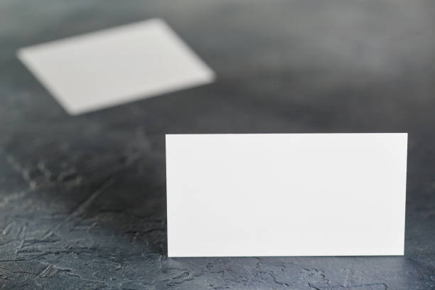 istock White Blank business card on concrete background. Place for ID 908800036