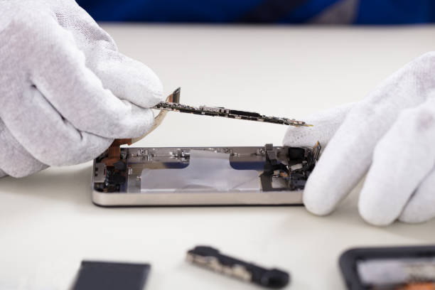 istock Person Repairing Mobile Phone 908801716