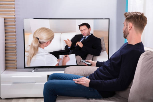 istock Side View Of A Young Man Watching Television 908806992