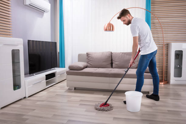 istock Man Cleaning Floor With Mop 908807058