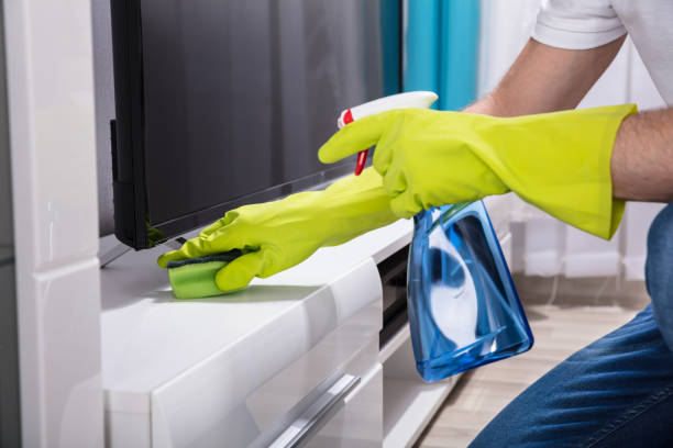 istock Person's Hand Cleaning Furniture With Sponge 908807068