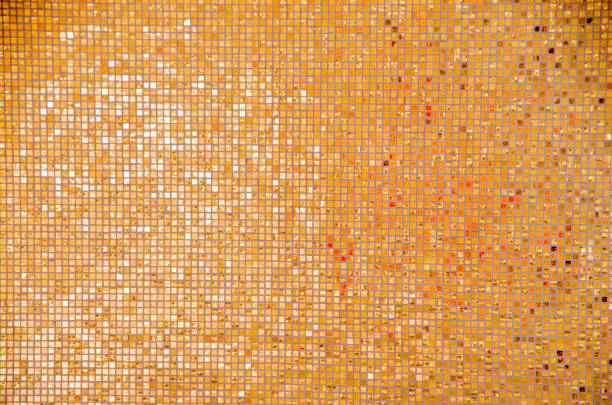 istock Golden and yellow background make by small pieces of tile. 908807824