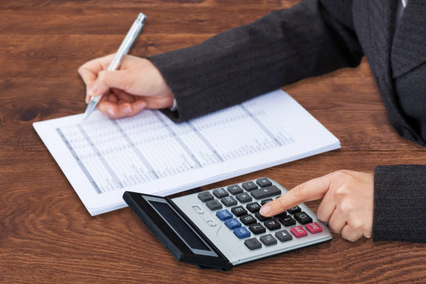 istock Businessperson Calculating Bill 908821306
