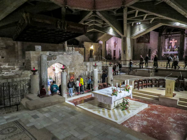 The Basilica of the Annunciation, Nazareth, Israel Nazareth, Israel - December 27, 2017: People are visiting the Interior of the Basilica of the Annunciation, the site where the Archangel Gabriel announced the future birth of Jesus to Mary tomb of the virgin mary in jerusalem stock pictures, royalty-free photos & images