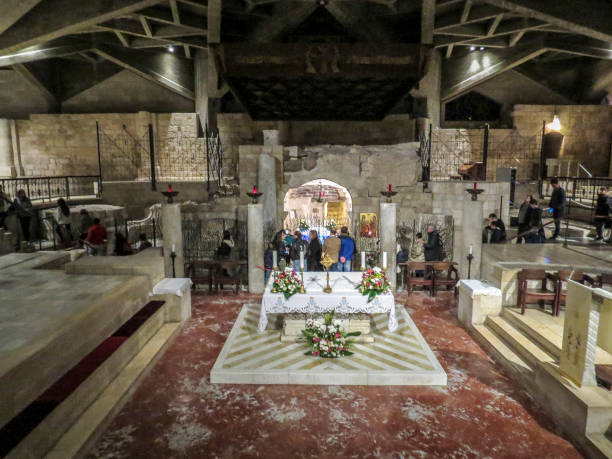 The Basilica of the Annunciation, Nazareth, Israel Nazareth, Israel - December 27, 2017: People are visiting the Interior of the Basilica of the Annunciation, the site where the Archangel Gabriel announced the future birth of Jesus to Mary tomb of the virgin mary in jerusalem stock pictures, royalty-free photos & images