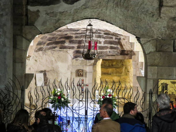 The Basilica of the Annunciation, Nazareth, Israel Nazareth, Israel - December 27, 2017: People are visiting the Interior of the Basilica of the Annunciation, the site where the Archangel Gabriel announced the future birth of Jesus to Mary tomb of the virgin mary in jerusalem stock pictures, royalty-free photos & images