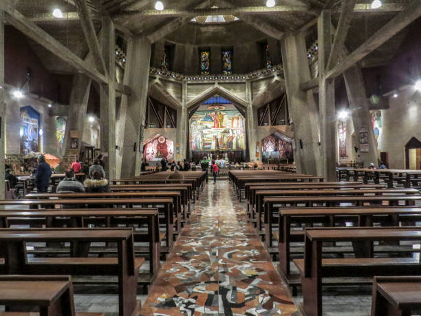 The Basilica of the Annunciation, Nazareth, Israel Nazareth, Israel - December 27, 2017: People are visiting the Interior of the Basilica of the Annunciation, the site where the Archangel Gabriel announced the future birth of Jesus to Mary tomb of the virgin mary in jerusalem stock pictures, royalty-free photos & images