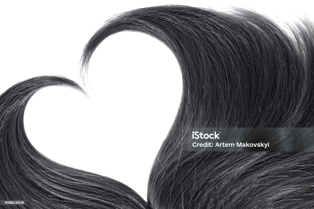 Black hair in shape of heart on white Brown ponytail isolated on white Black Hair Stock Photo