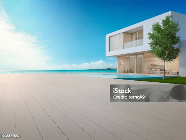Luxury Beach House With Sea View Swimming Pool And Terrace In Modern Design Empty Wooden Floor Deck At Vacation Home Or Hotel 3d Illustration Of Contemporary Holiday Villa Exterior Stock Photo - Download Image Now