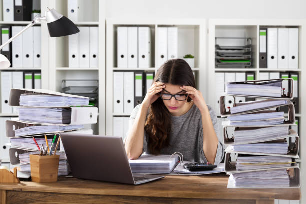 istock Worried Businesswoman Working At Office 908827620