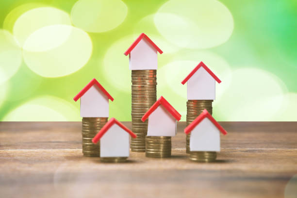 istock House Models Placed On Top Of Stacked Coins 908827748