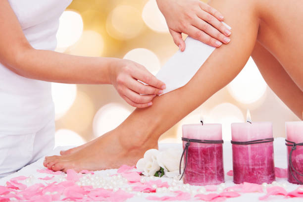 istock Beautician Waxing A Woman's Leg 908827756