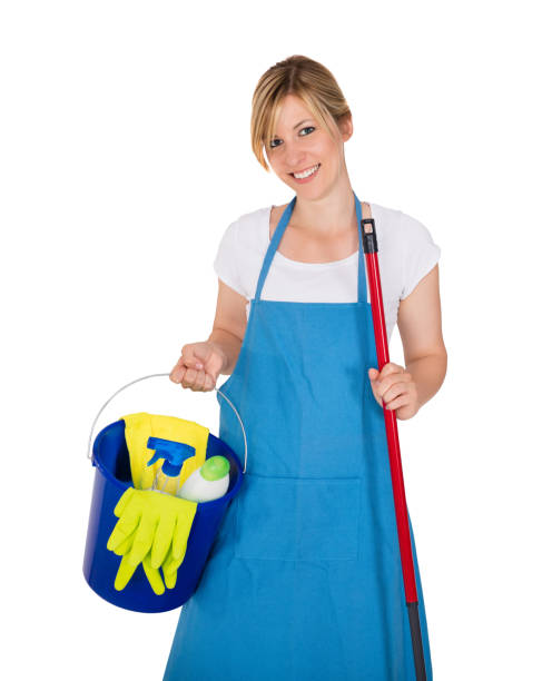 istock Housemaid Holding Cleaning Equipment In Kitchen 908830642