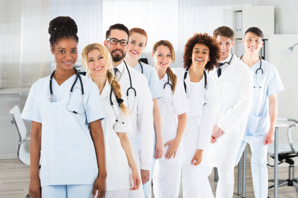 istock Happy Medical Team With Stethoscope 908830780