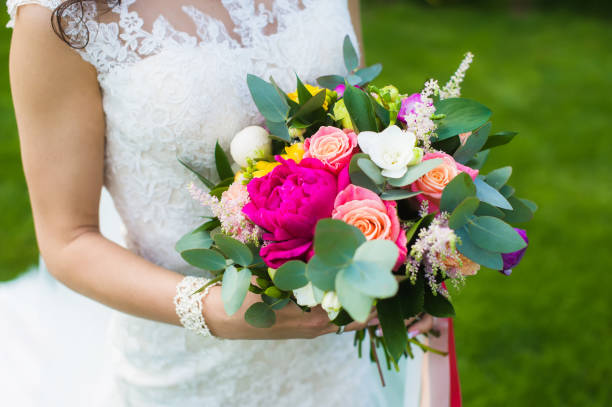 istock Beautiful bride in white lace dress with bracelet 908834366