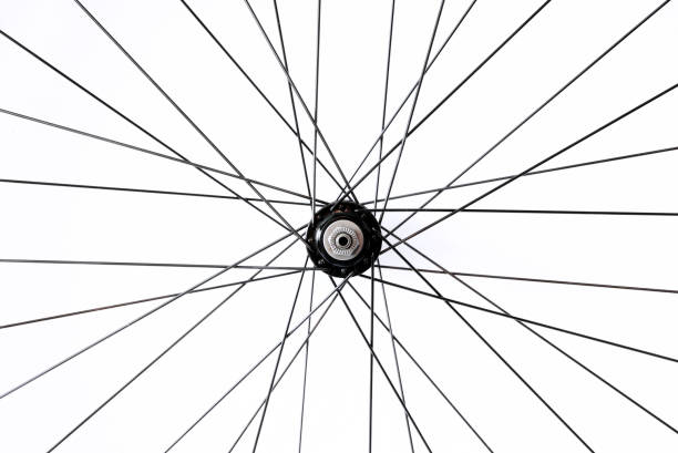 istock Black and alloy bicycle spokes isolated on white background 908834508