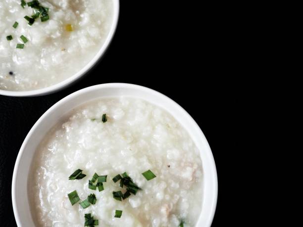 istock Korean rice porridge on black background 908840032