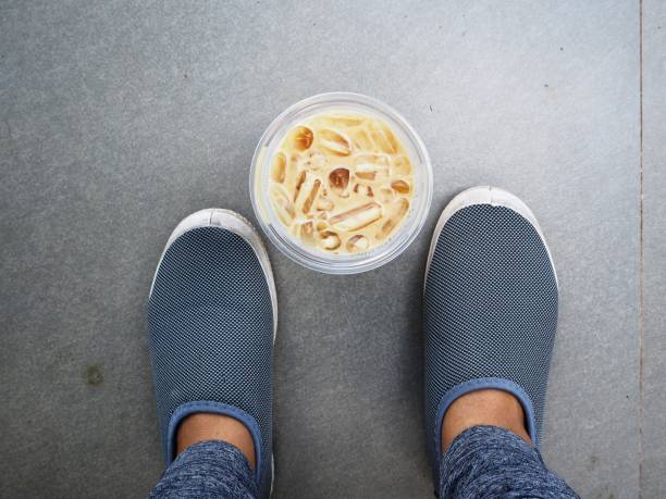 Selfie of iced coffee with shoes