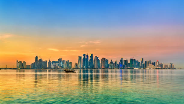 Skyline of Doha at sunset. The capital of Qatar Skyline of Doha at sunset. Qatar, the Middle East qatar photos stock pictures, royalty-free photos & images
