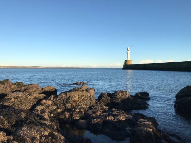 istock Aberdeen Lighthouse in front of Blue Sky 908844474