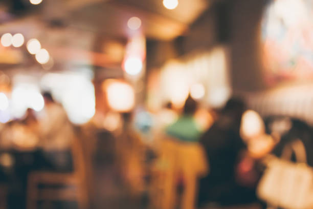 istock Restaurant cafe or coffee shop interior with people abstract blur background 908849816