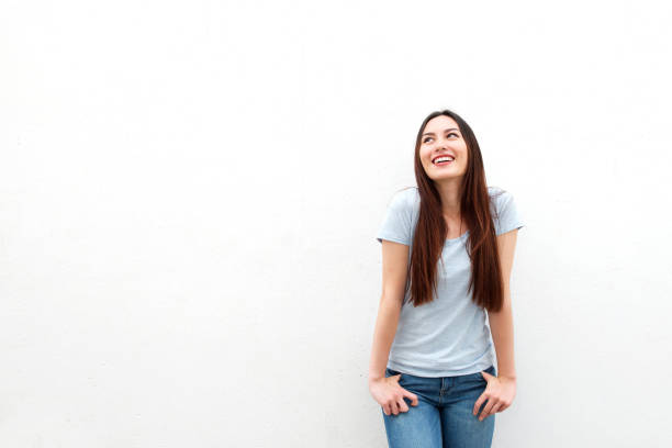 istock Cute young woman smiling on white background 908851008