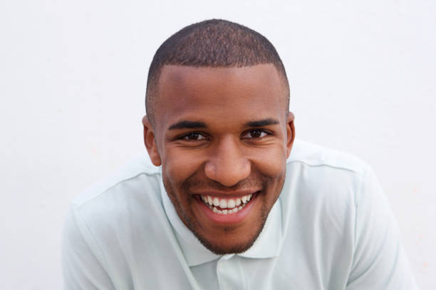 istock Close up cheerful african man smiling on white background 908851282