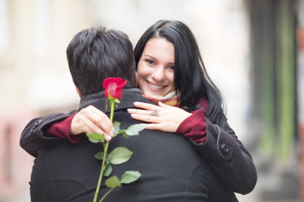 istock Happy couple in love with a rose 908851514