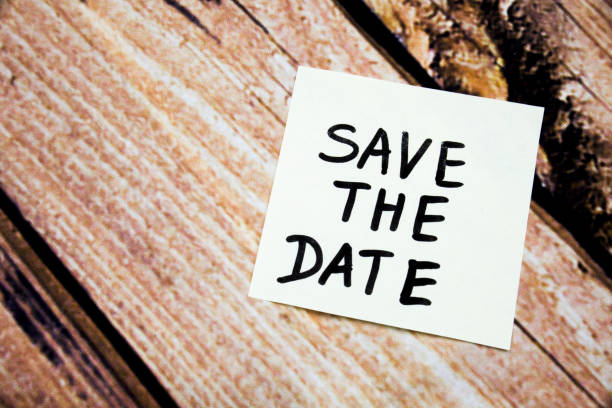 istock sticky note on the wooden background with the phrase save the date. room for text 908859514