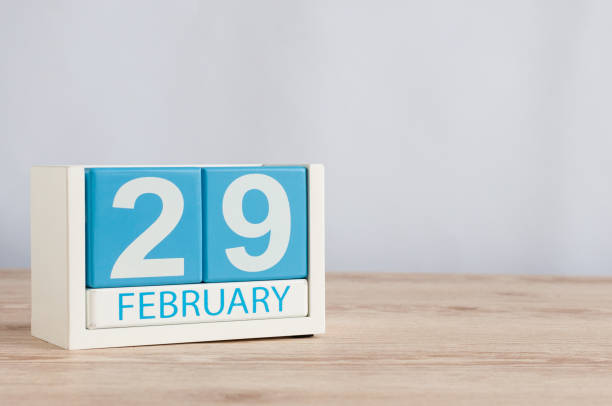 istock February 29th. Cube calendar for february 29 on wooden surface with empty space For text. Leap year, intercalary day 908862520
