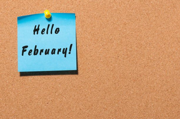 istock hello February on sticker pinned on cork notice board with empty space for text 908862576