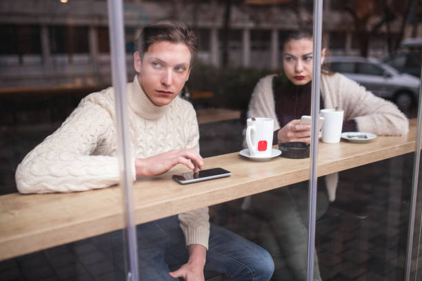 istock Young Couple Having Conflict In Cafe 908871892