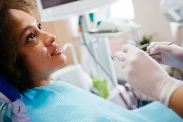 istock Female at dental examination 908872244