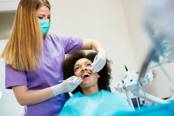 istock Female dentist with her patient 908875330