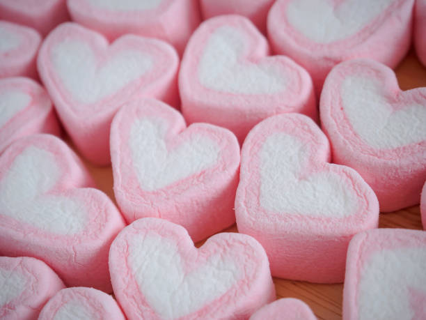 istock pink heart shape marshmallow for valentines background 908878656