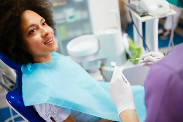 istock Young female at dentist 908881812