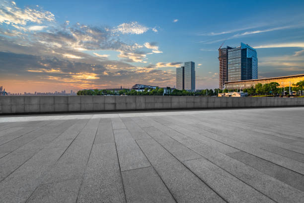 istock Empty pavement and the city financial district 908894328