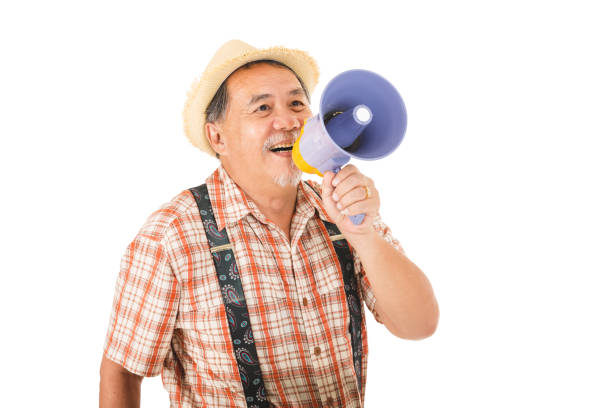 Asian senior man holding with megaphone shouting